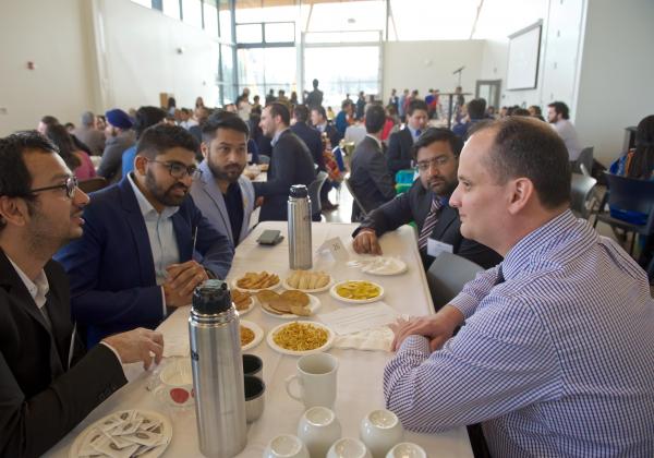 Employers and MBA students at a networking event