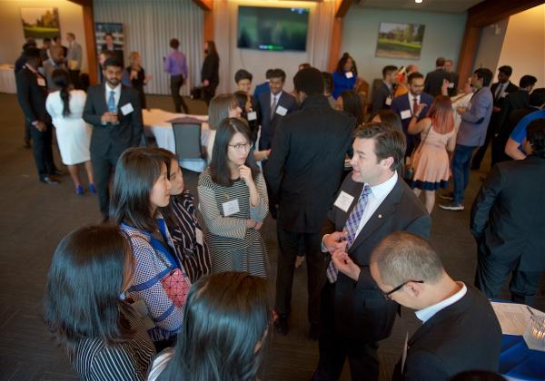 A large group of employers and students at an MBA networking event