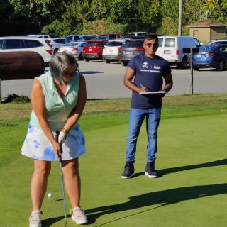 Tony Prem overseeing a hole in one contest at the Chamber of Commerce Golf Tournament