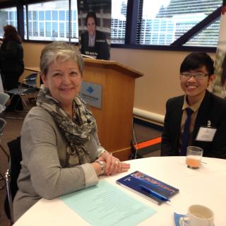 An employer and a student posing for a picture at the LMRT event