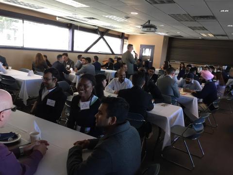 Students and employers sitting at tables during the LMRT